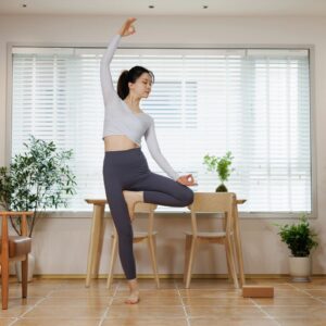 attractive asian woman practicing yoga in side bend pose